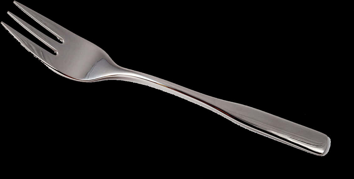 A Silver Spoon On A Black Background