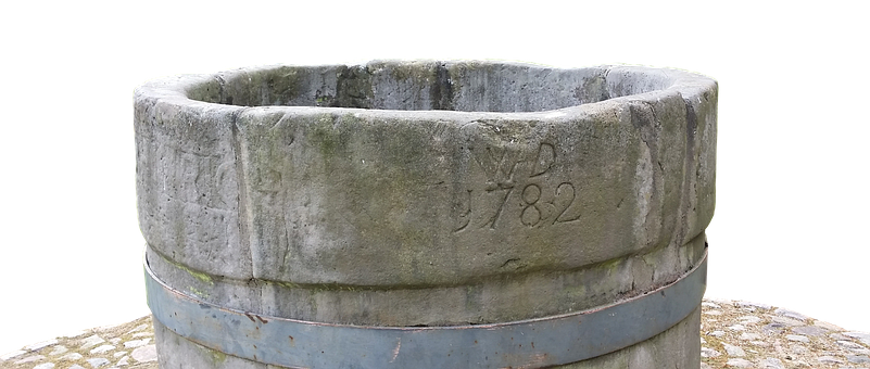 A Stone Bucket With Engraved Text