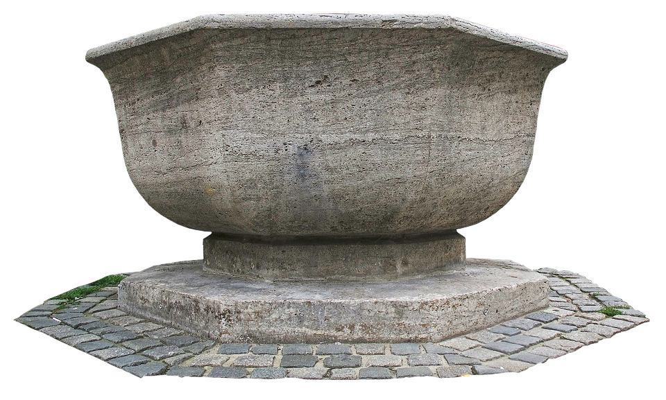 A Large Stone Bowl On A Pedestal