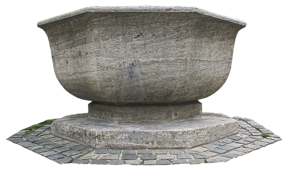 A Large Stone Bowl On A Black Background