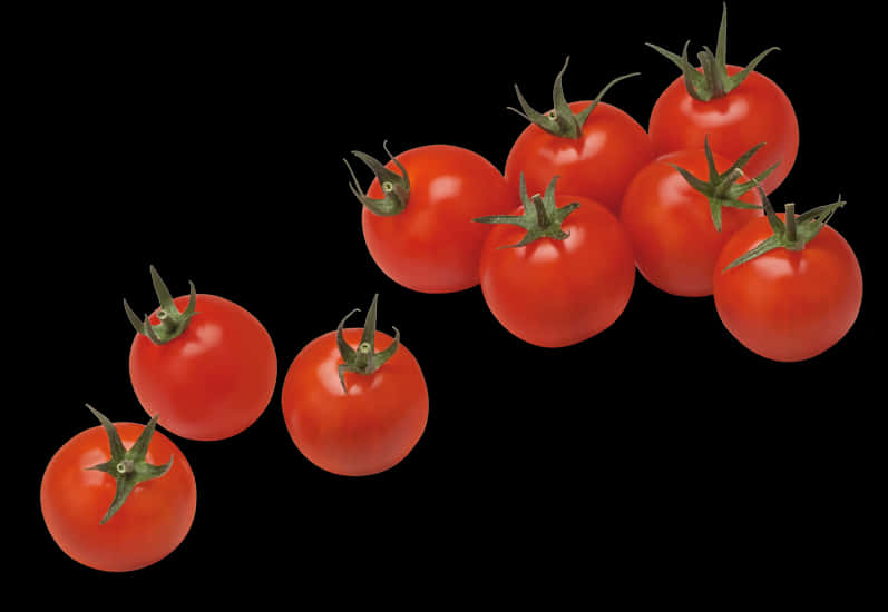 A Group Of Tomatoes On A Black Background