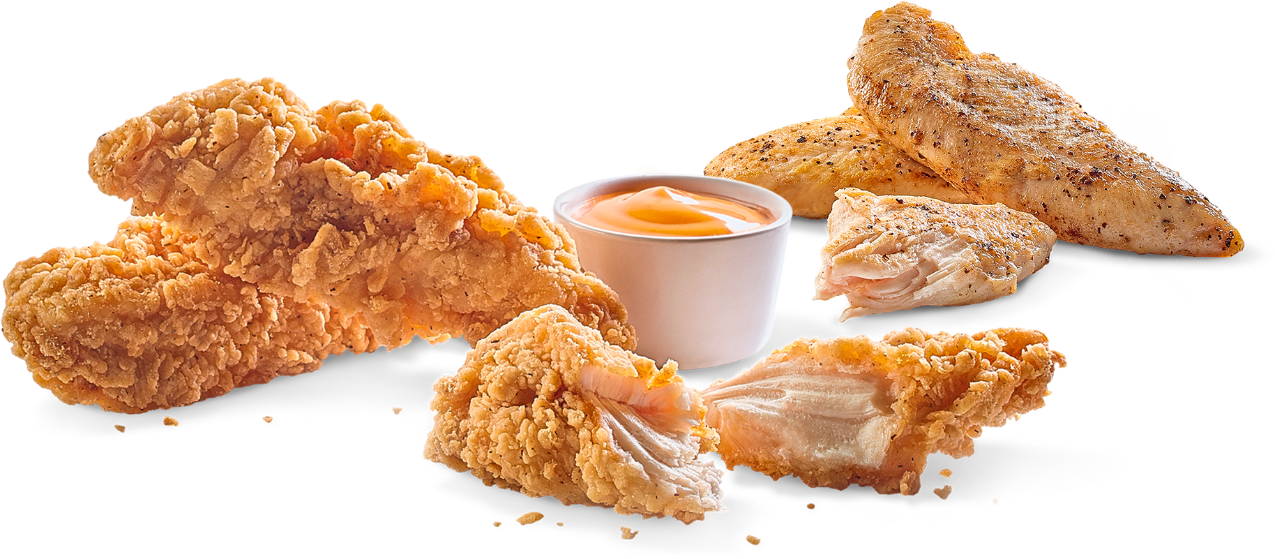 A Group Of Fried Chicken Pieces And A Cup Of Sauce