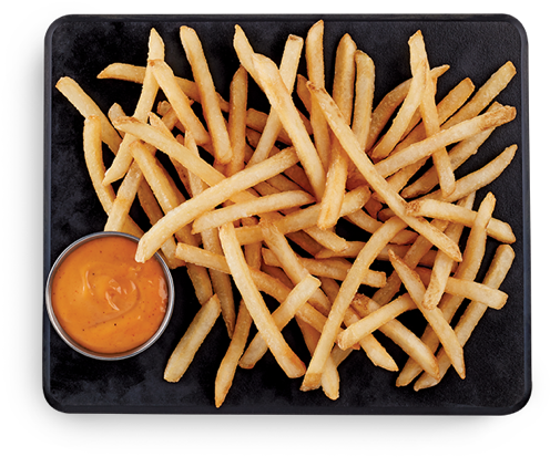 A Plate Of French Fries With A Small Sauce