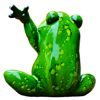 A Green Frog Statue With Its Hand Up