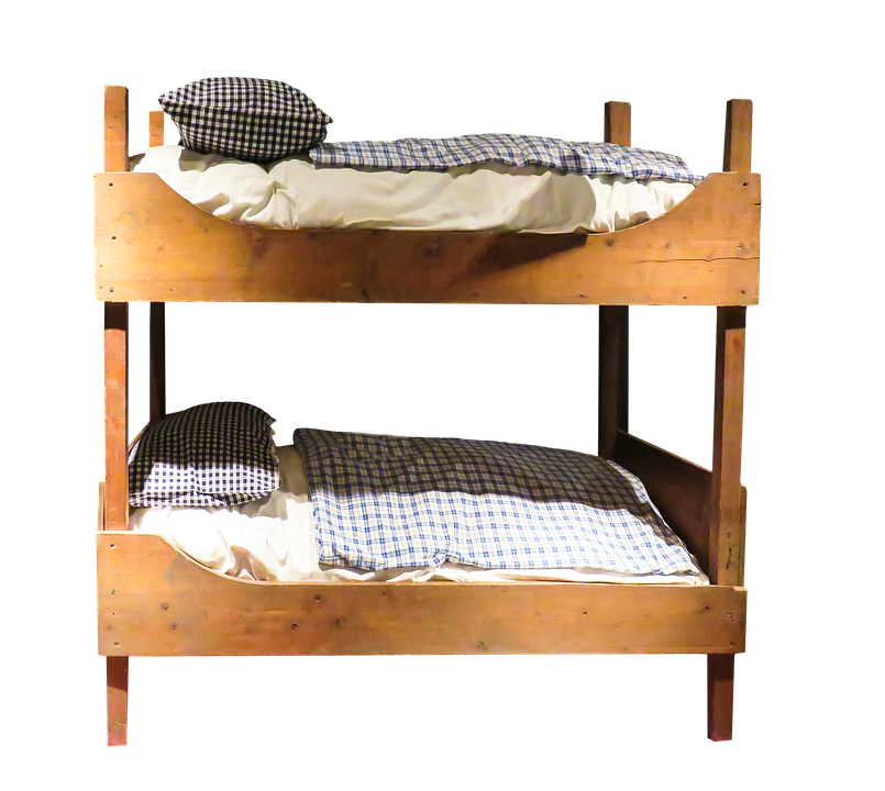A Bunk Bed With Pillows And Blankets