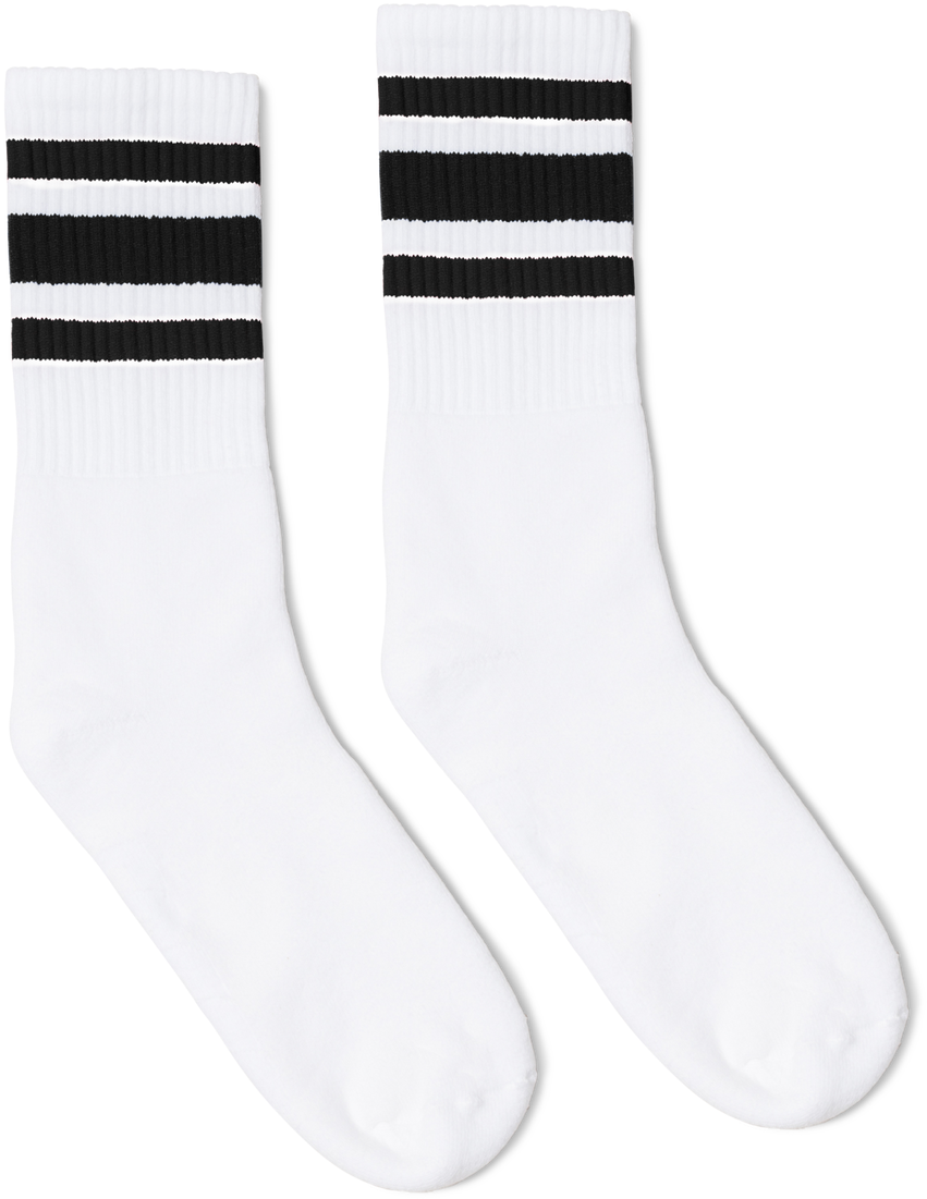 A Pair Of White Socks With Black Stripes