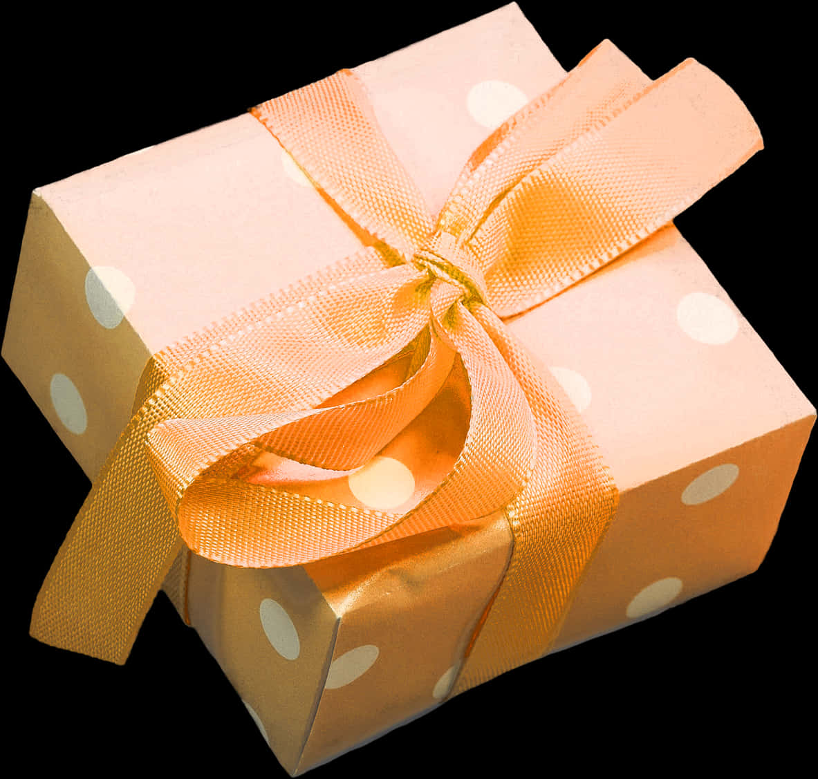 A Box Wrapped In Paper With A Bow