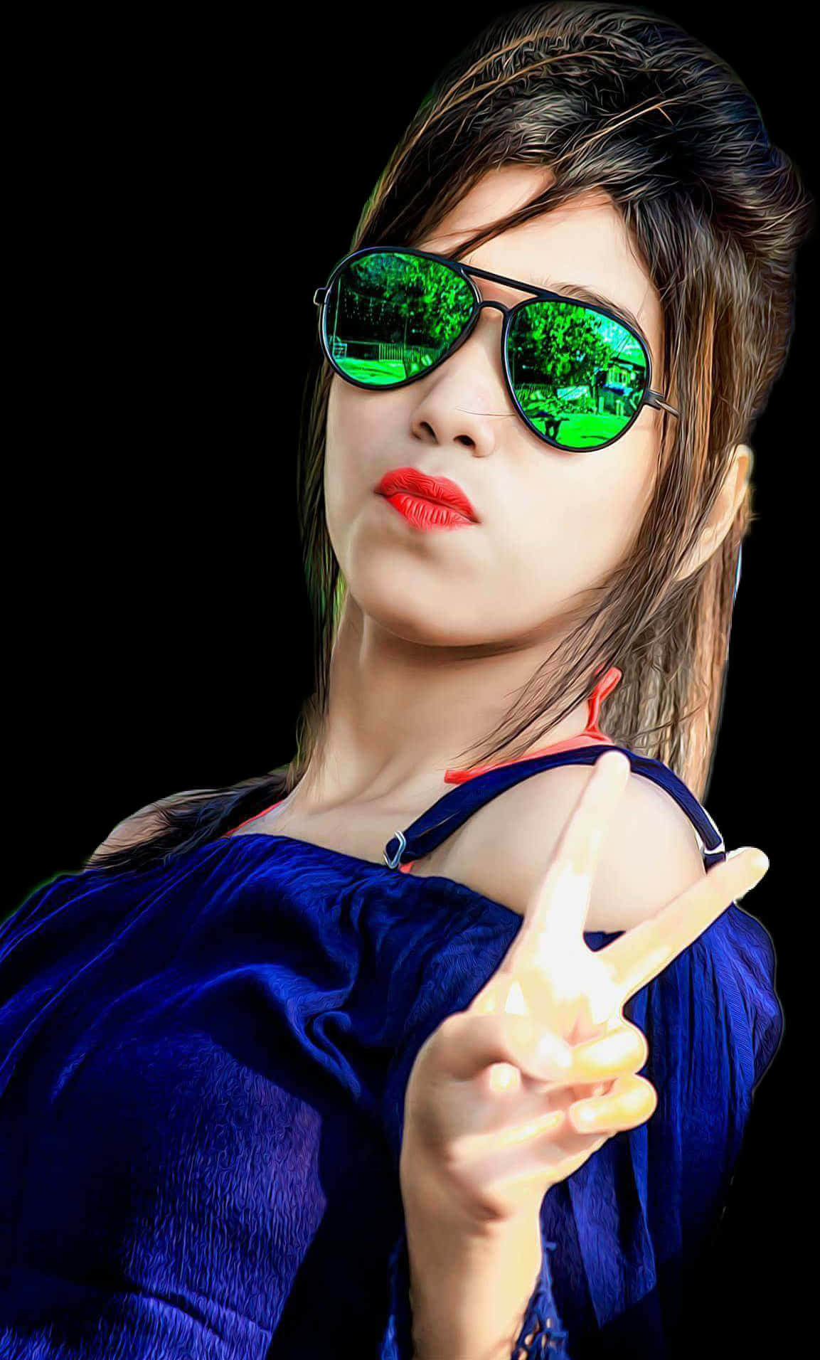 A Woman Wearing Sunglasses And Blue Top Making A Peace Sign
