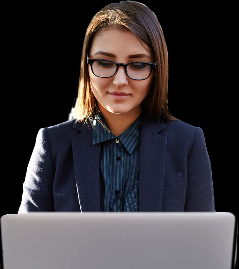 A Woman In A Suit And Glasses Looking At A Laptop