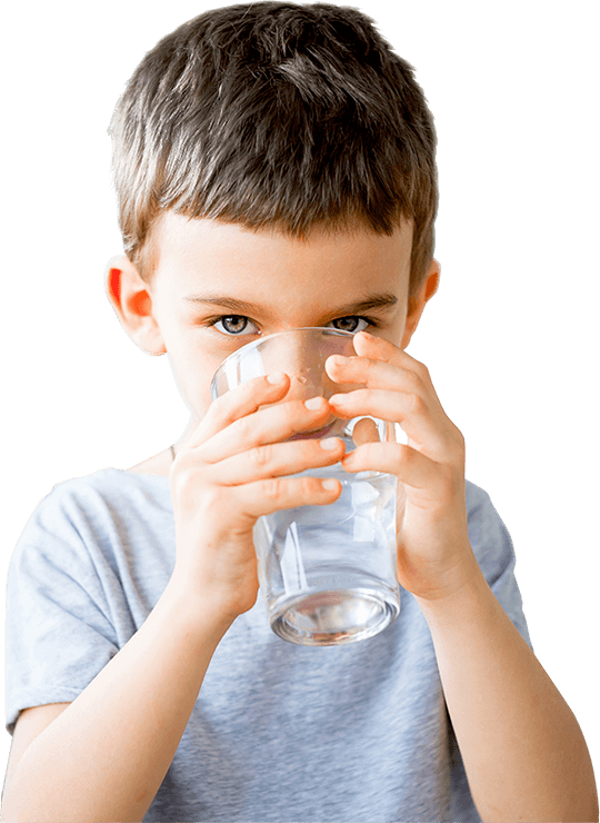A Boy Drinking From A Glass