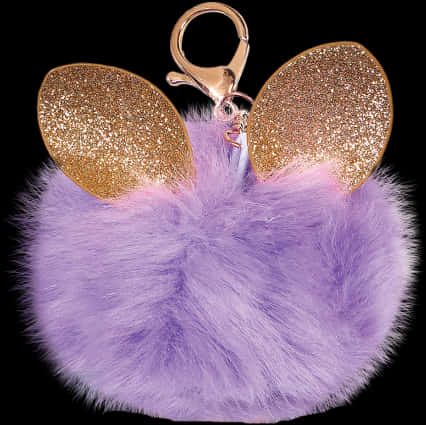 A Purple Fluffy Keychain With Gold Ears