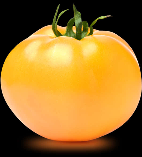 A Yellow Tomato With Green Leaves