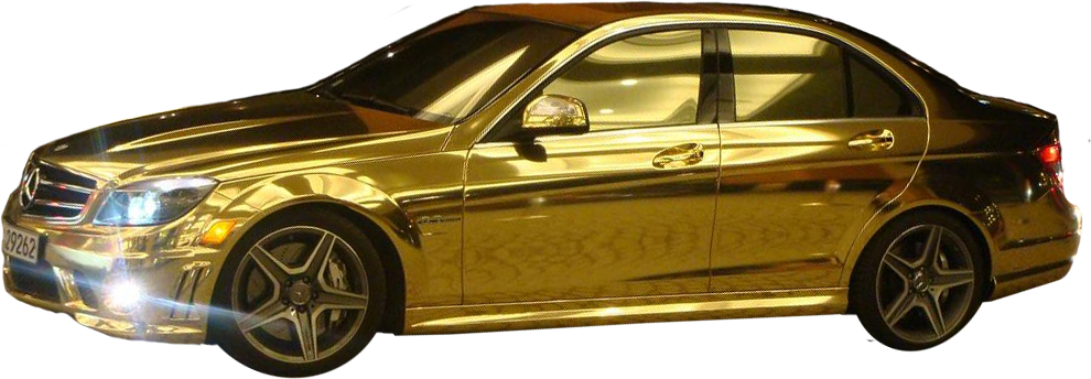 A Shiny Gold Car With A Black Background