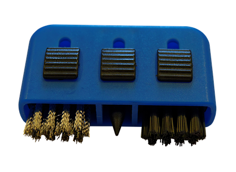 A Blue Brush Holder With Black And Gold Brushes
