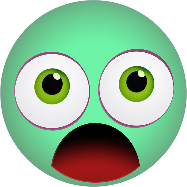 A Green Face With White Eyes And A Red Mouth