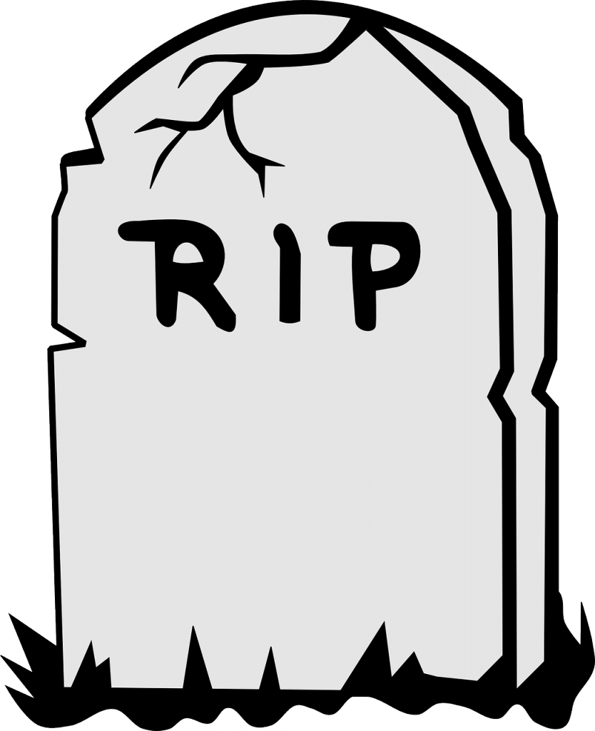 A White Tombstone With Black Text