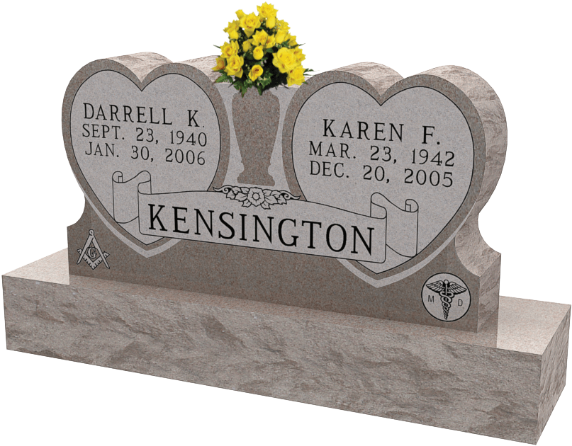 A Tombstone With Flowers On It