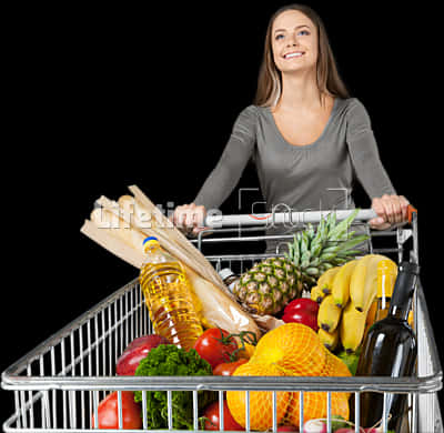 A Woman Pushing A Shopping Cart Full Of Food