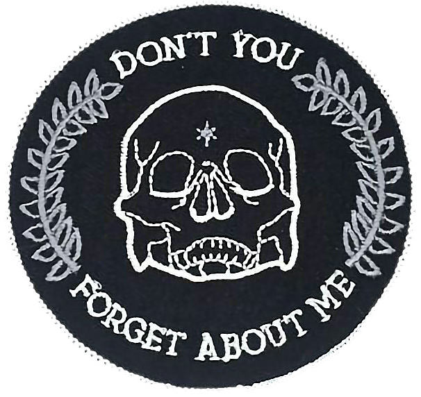 A Patch With A Skull And Text