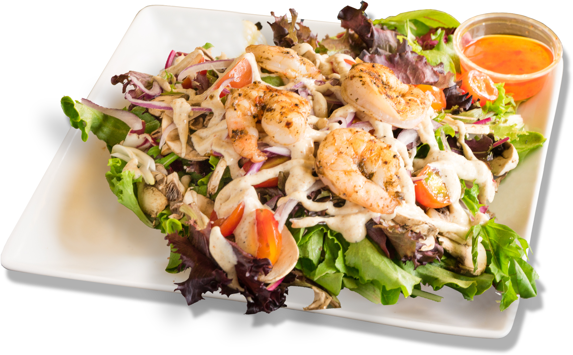 A Plate Of Salad With Shrimp And Vegetables