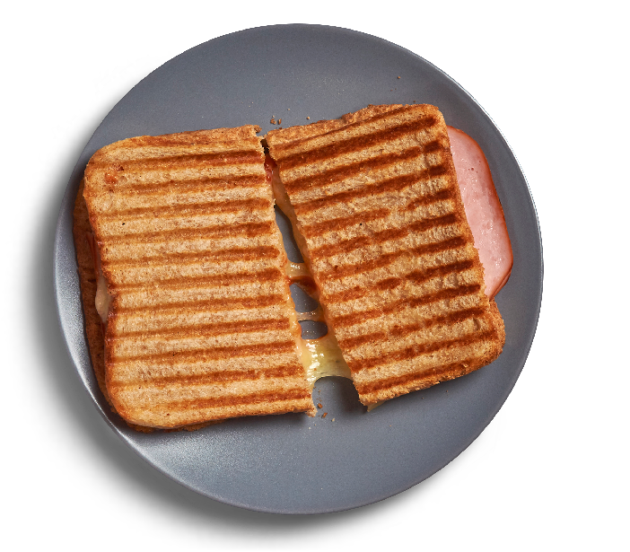 A Grilled Sandwich On A Plate