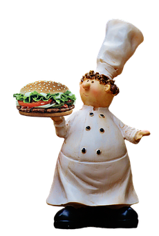 A Chef Holding A Burger