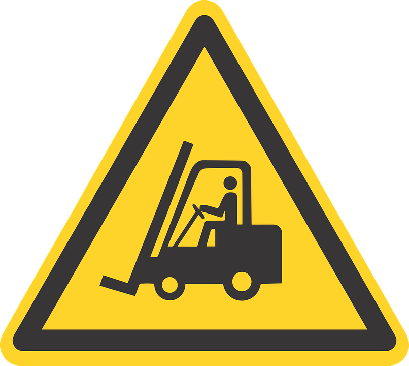 A Yellow Triangle Sign With A Person Driving A Forklift