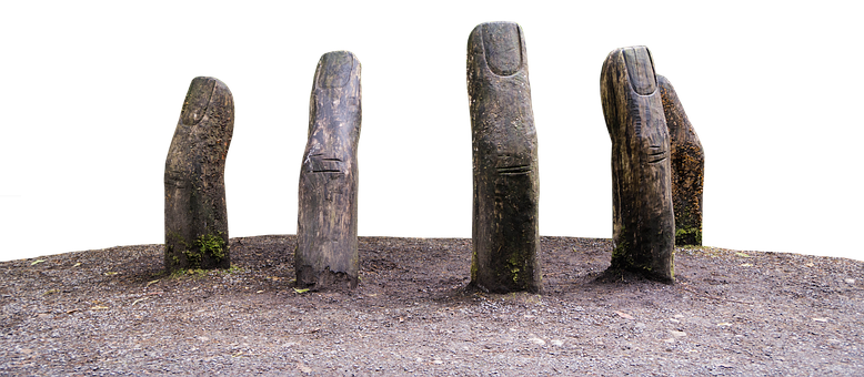 A Group Of Carved Wooden Posts