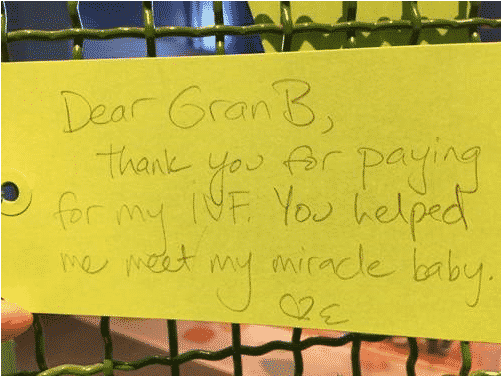 A Yellow Note On A Fence