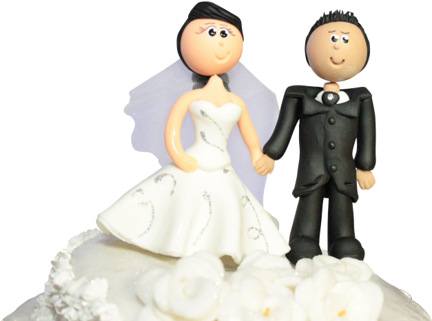 A Wedding Cake Topper With A Bride And Groom On Top