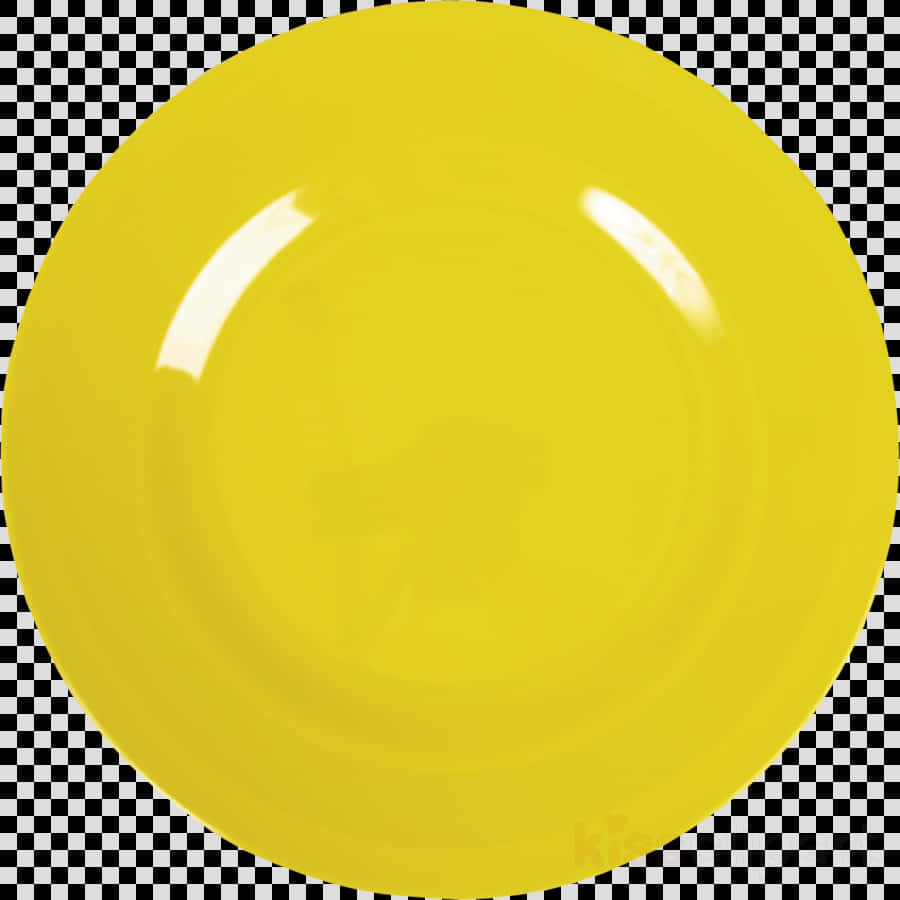 A Yellow Plate On A Checkered Background