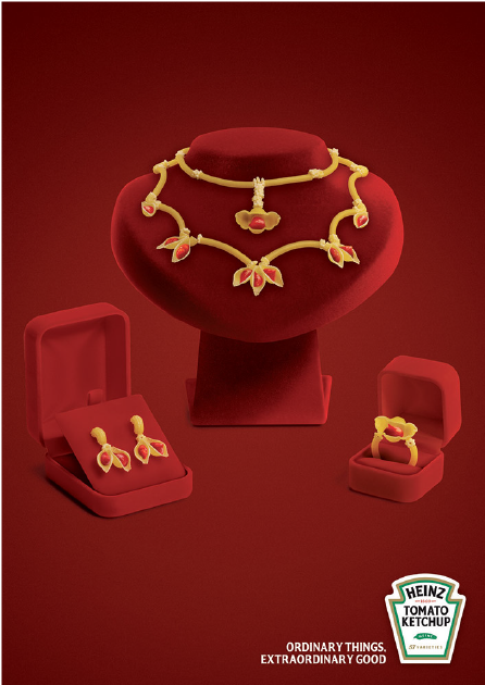A Red Jewelry Box With Gold Necklace And Earrings