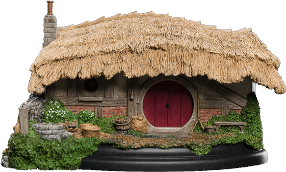 A Small House With A Thatched Roof
