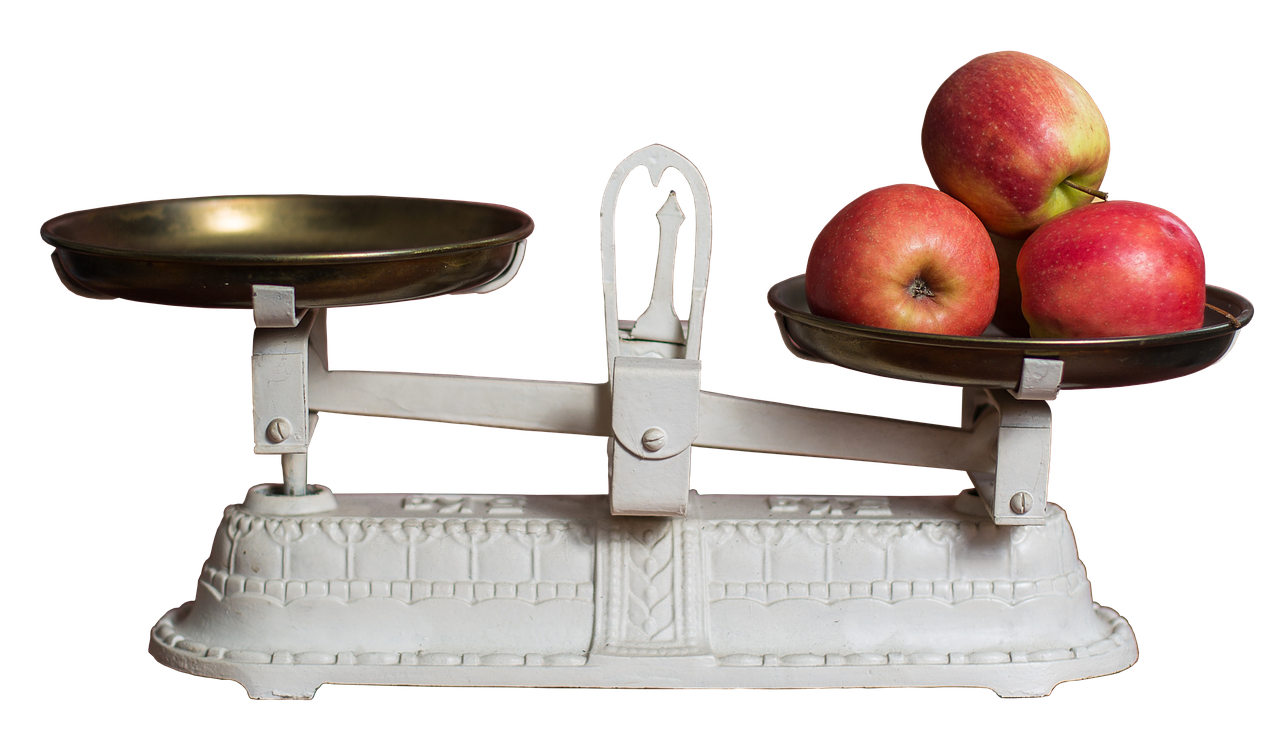 A White Scale With Apples On It