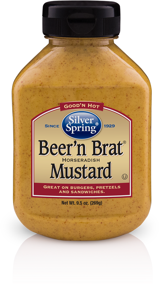 A Jar Of Mustard On A Black Background