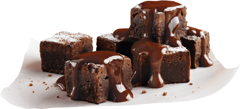 A Group Of Brownies With Chocolate Sauce