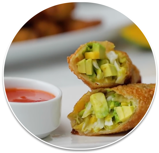 Egg Rolls With Avocado And Vegetables On A Plate