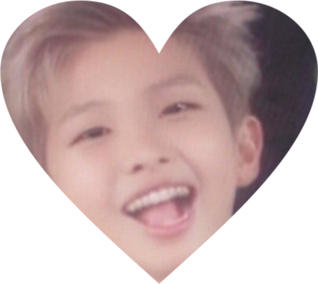 A Boy Smiling In A Heart Shape