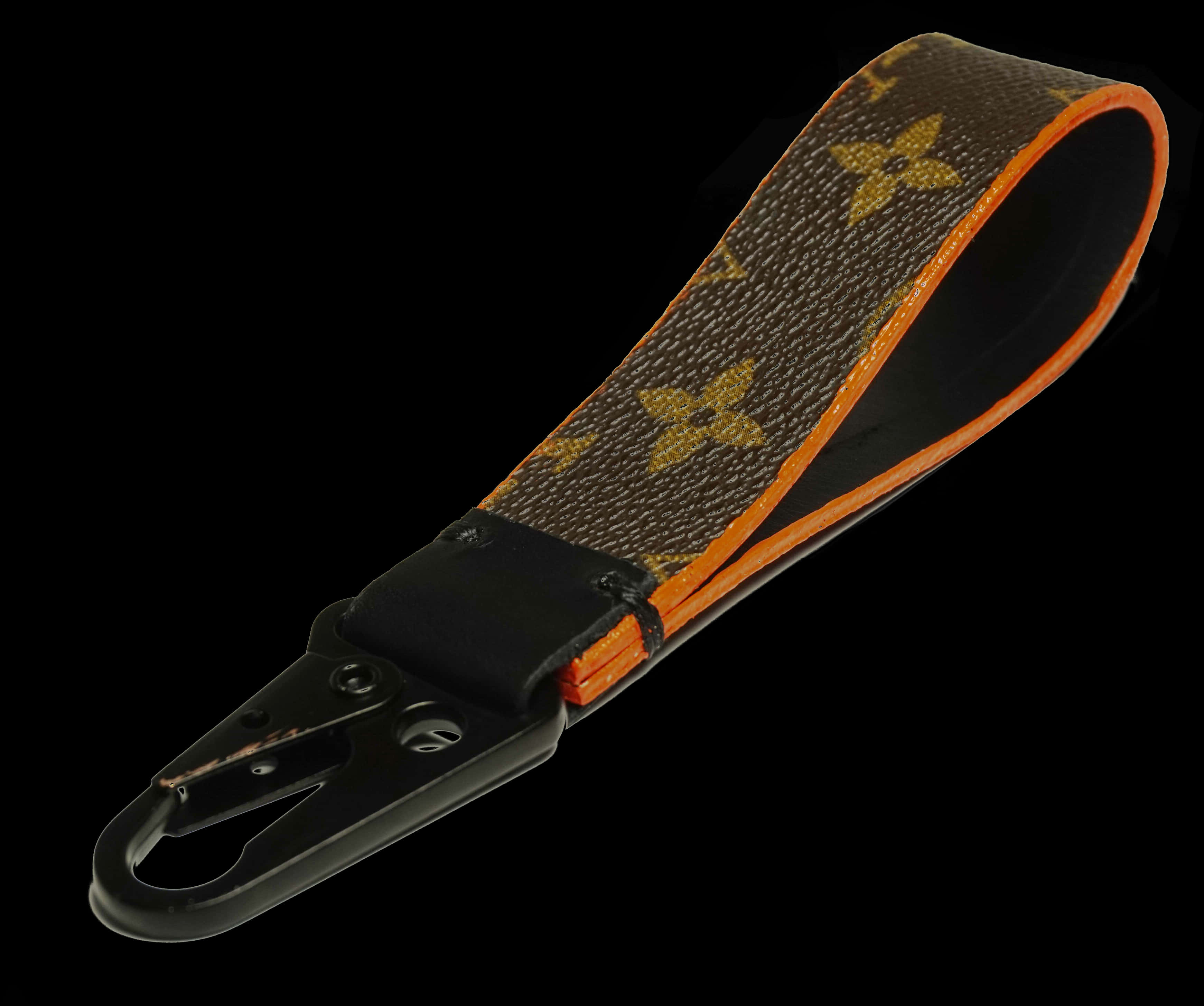 A Brown And Orange Strap With A Black Handle