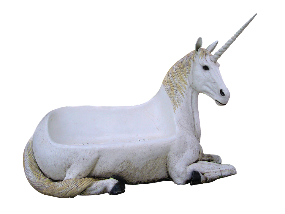 A White Unicorn Statue With A Horn