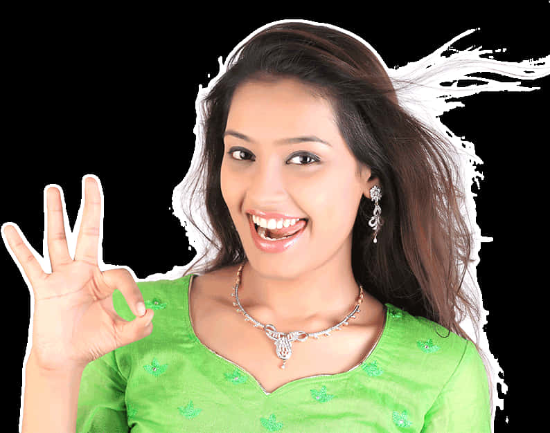 A Woman Smiling And Giving A Hand Sign