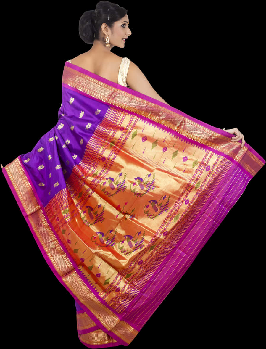 A Woman In A Purple And Orange Sari