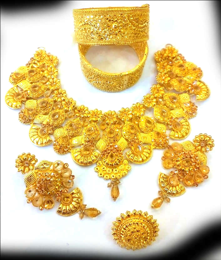 A Gold Necklace And Bracelet