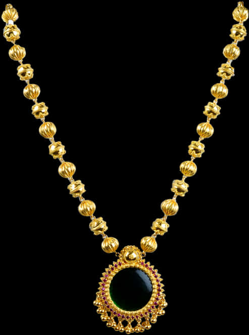 A Gold Necklace With A Black Stone Pendant