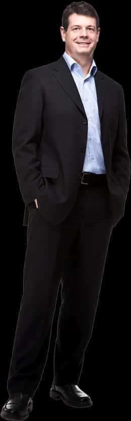 A Man In A Suit With His Hands In His Pockets