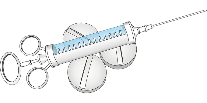 A Syringe And Tablets