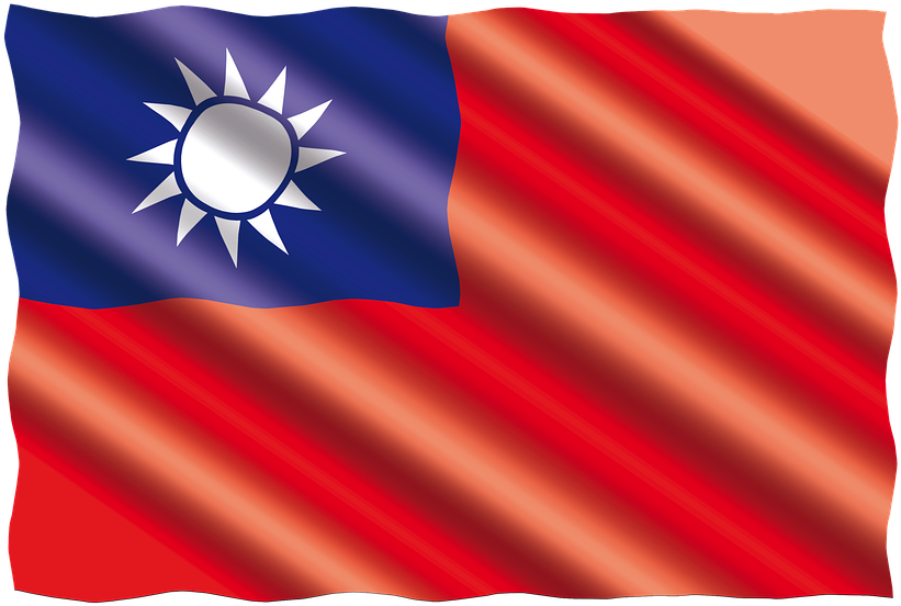 A Red And Blue Flag With A White Sun