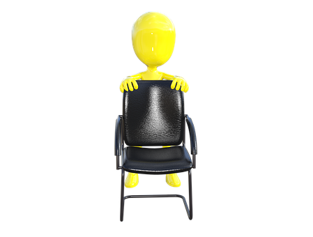 A Yellow Figure Sitting On A Chair