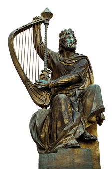A Statue Of A Man Playing A Harp