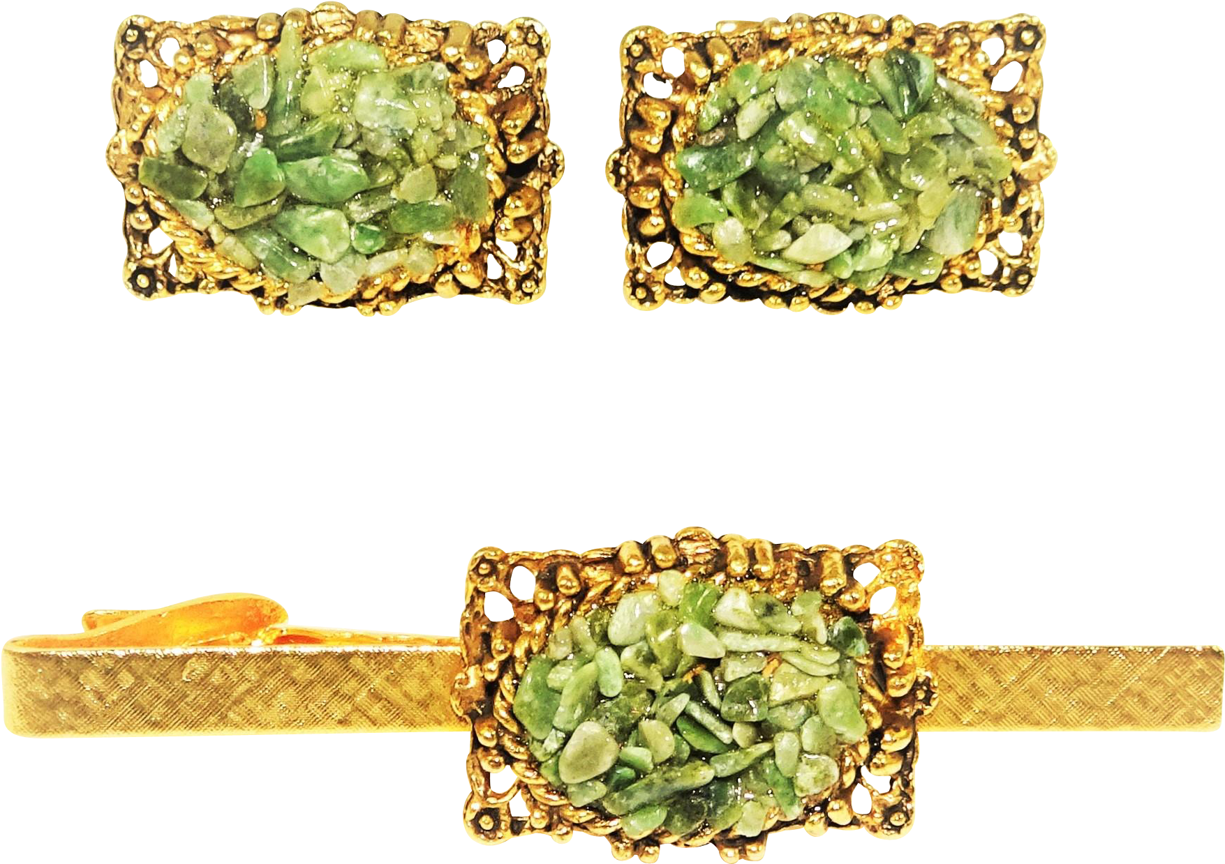 A Gold And Green Clip With Green Stones